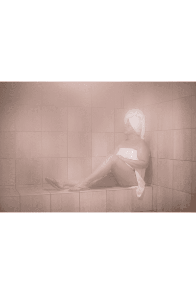 woman enjoying the steam room 