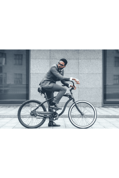 man riding bike with suit 