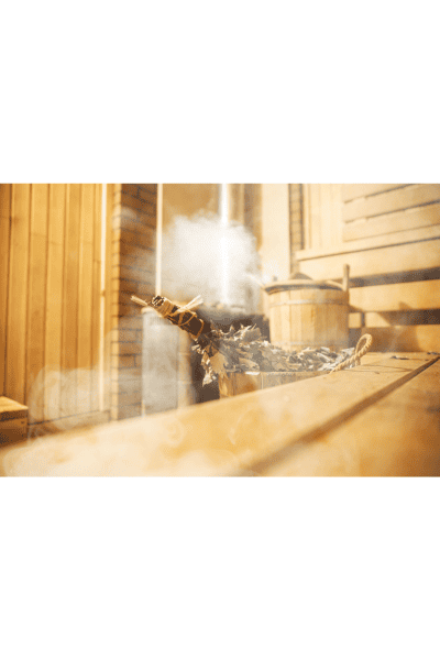 inside traditional sauna with herbs and steam 