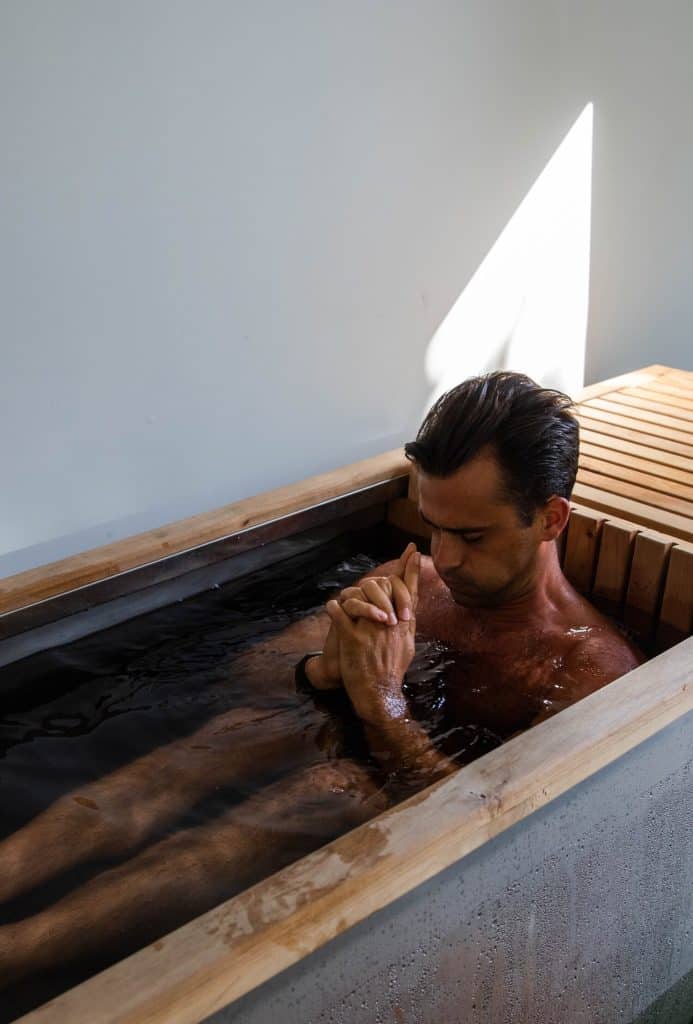 man enjoying ice bath 
